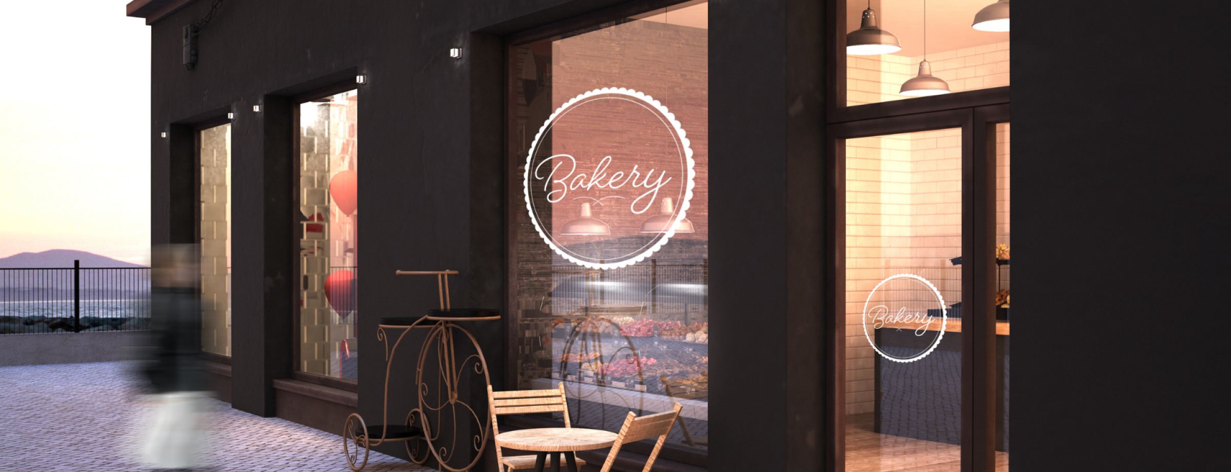 Evening view of a bakery storefront with outdoor seating